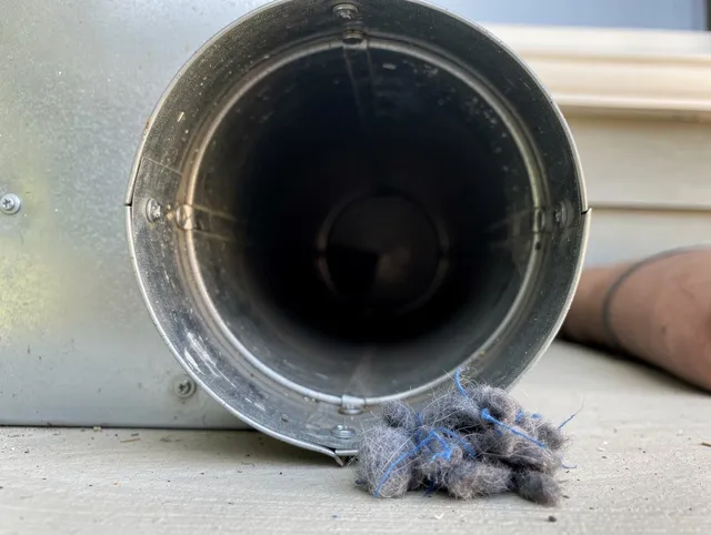 Cornelius Dryer Vent Cleaning technician using specialized equipment to clear severe dryer vent blockage in Cornelius